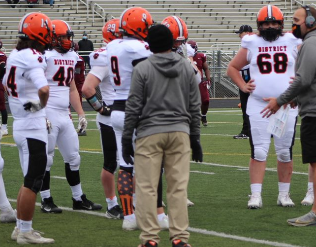 Defense huddle 2 Credit Katherine Meints.PNG